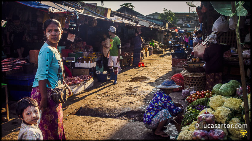 Myanmar - a mother and his son at the local market