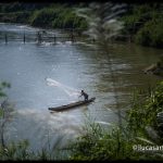 Fisherman in a river in Luang Prabang - Laos